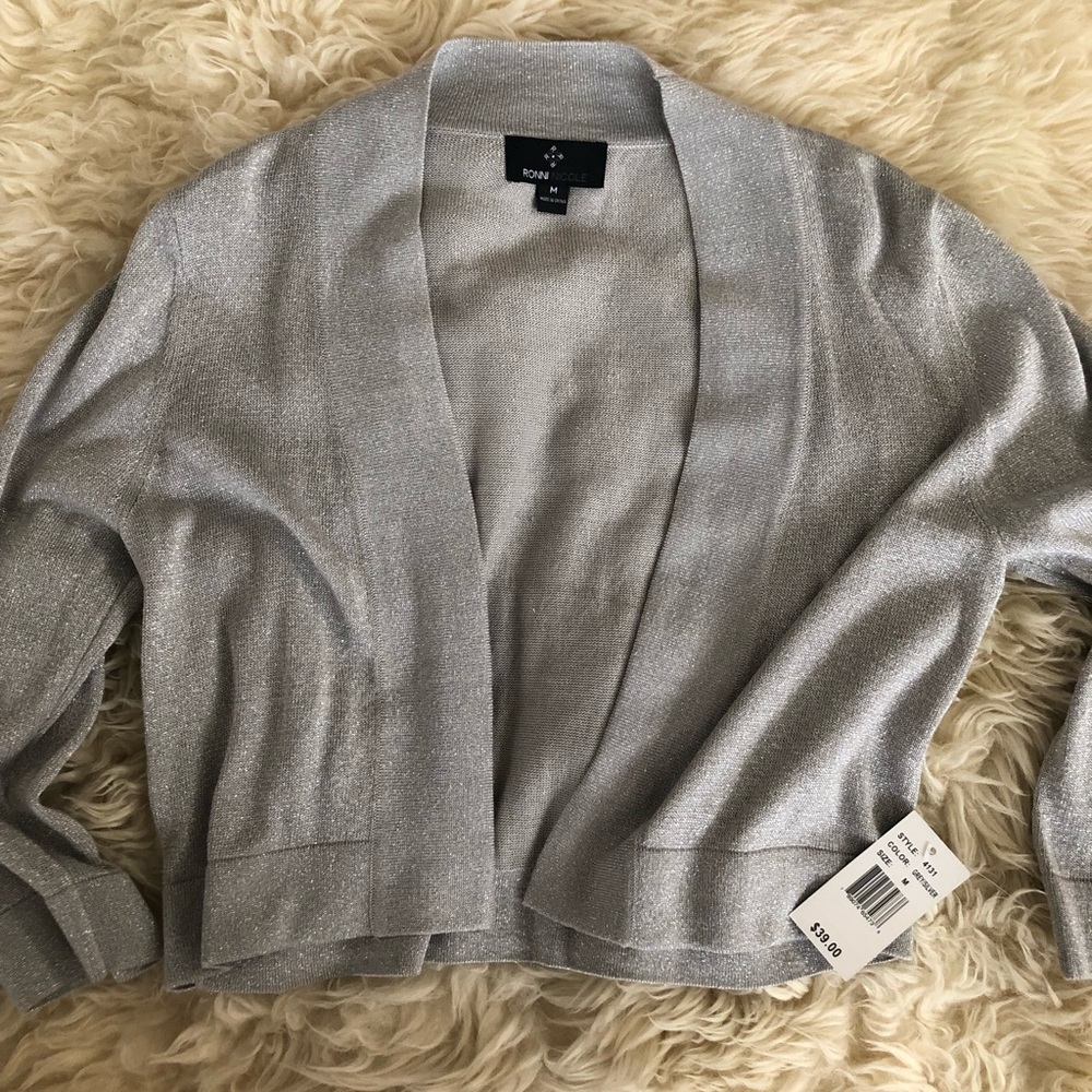 Silver cardigan. Size medium.